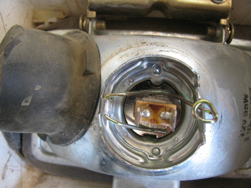 Headlight and shroud from a 1993 Suzuki DR350 dirt model.