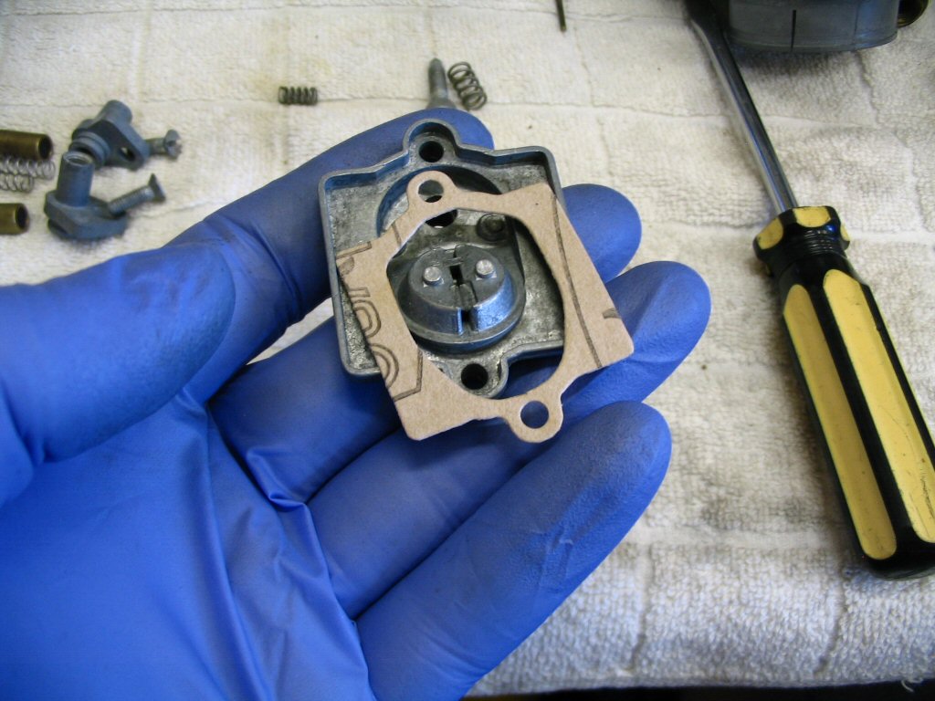 The carburetor top and gasket.