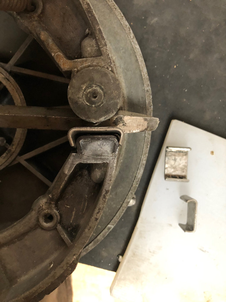 Bring each 8 mm end past 90 degrees so that the finished shape will resemble the hard insert in the nose of the above shoe. Please admire the cross-sectional and plan views of the two spare shims that I've left for you on my wife's cheese board (the port glass is out of shot).