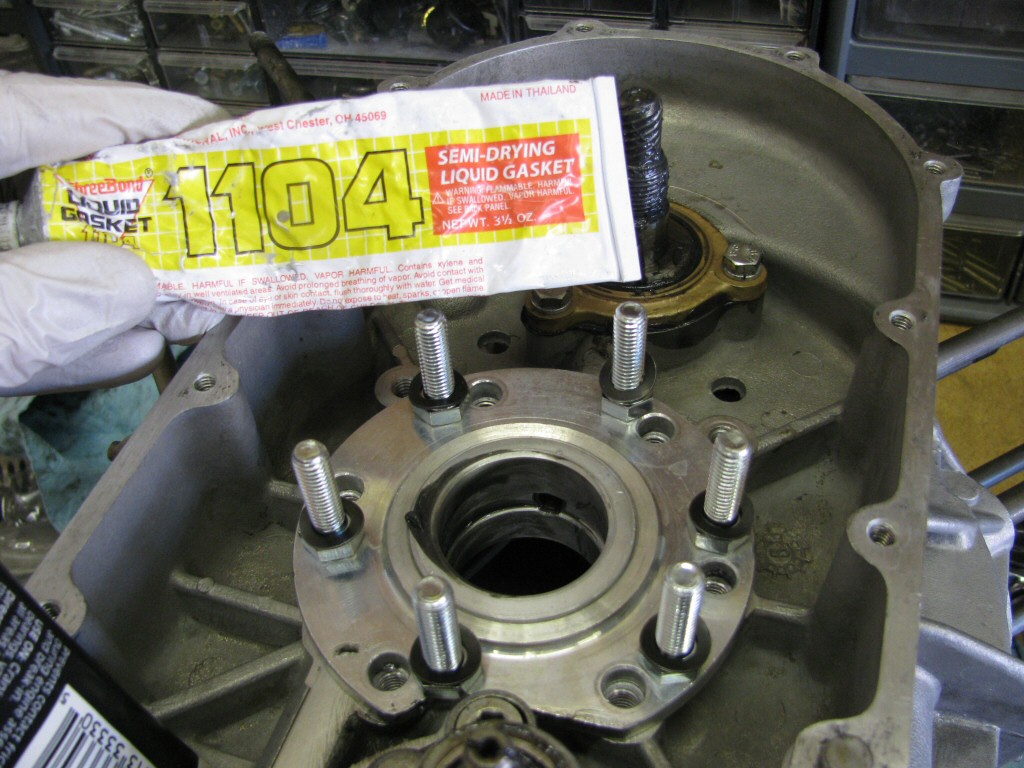 For the front main bearing I use new thick wave washers (this is what Guzzi now uses) and apply ThreeBond 1104 (or similar) to the threads. The ThreeBond product acts as a thread retaining compound without any risk of damaging the alluminum threads when removed later.