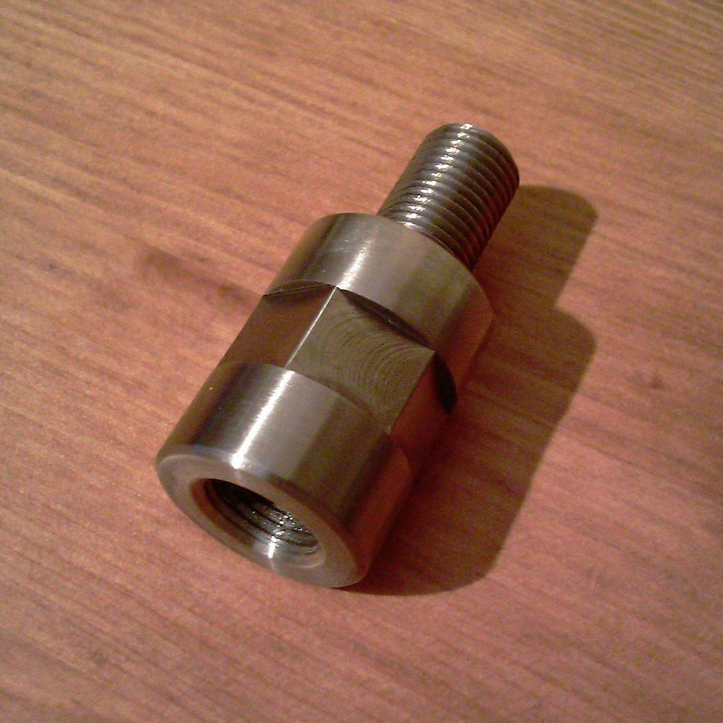 Rear shock spacer for mounting Wixom saddlebag brackets.