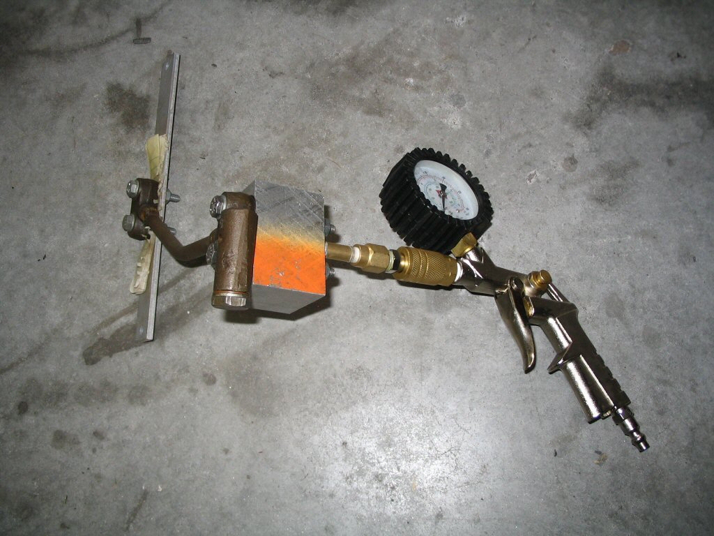 Pressure tester for an oil pressure relief valve.