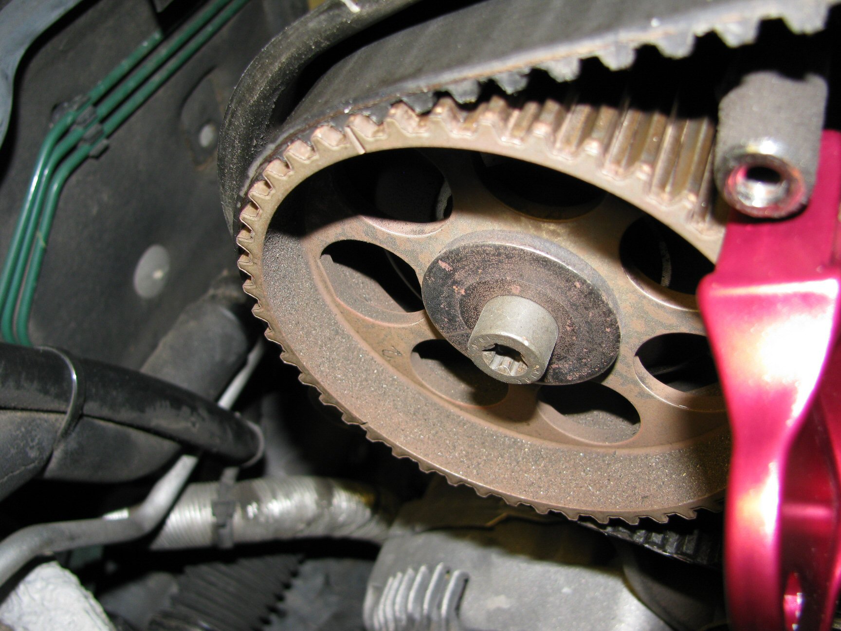 Camshaft pulley 1 aligned with notch in backing tin.