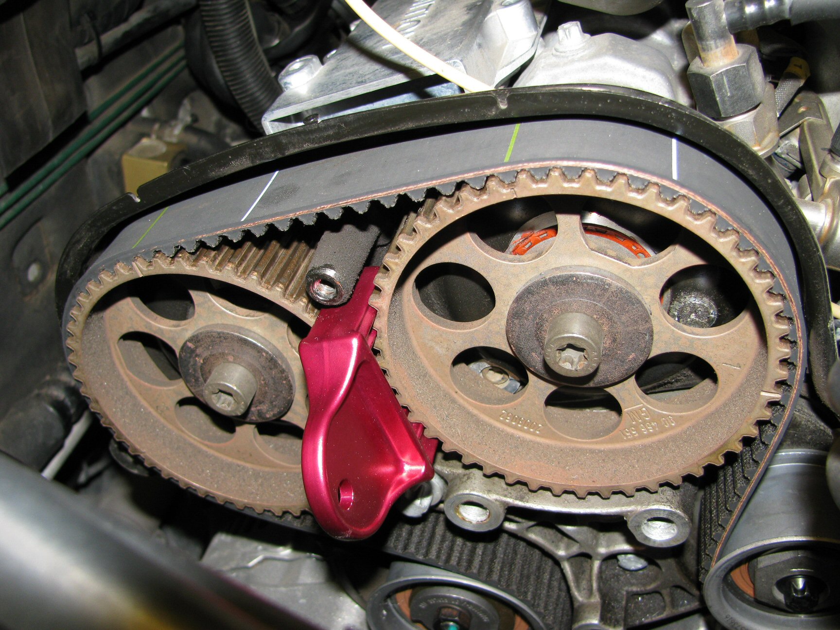 New belt positioned on camshaft pulleys 1 and 2. Note the green lines on the belt.